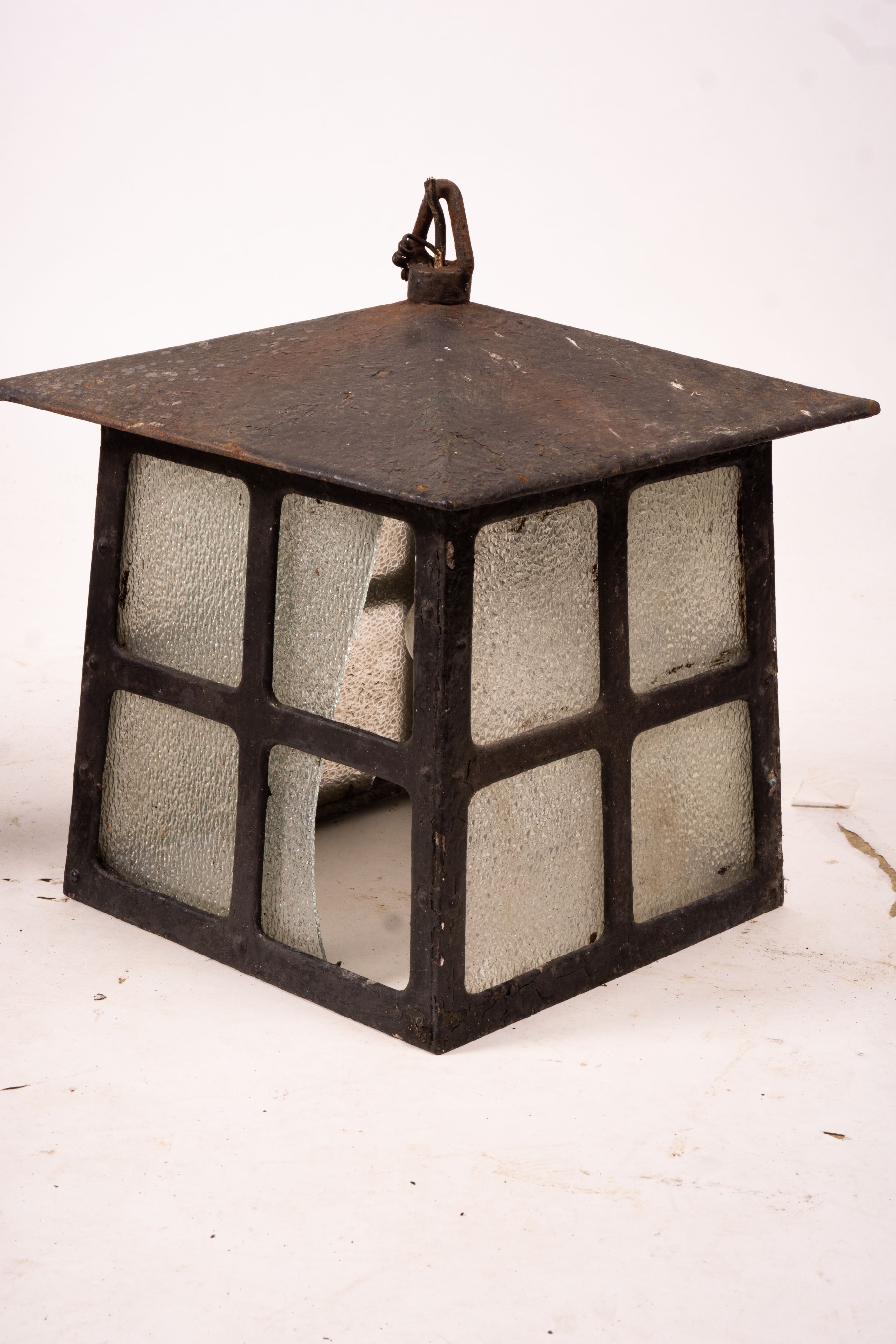 A Victorian style lantern on cast iron base, height 143cm together with a pair of lanterns and a pair of fire dogs